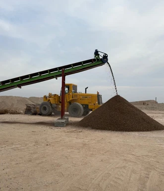 Crushed stone stockpile beside the crusher